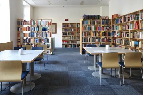 Reading room with bookshelves, tables and chairs