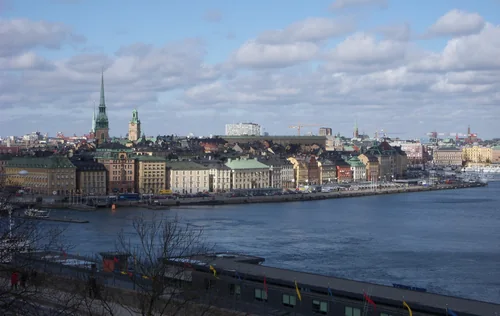 Panorama of the old town with spires on an island across wide water
